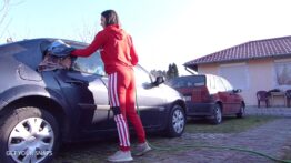 The car wash in the wet red tracksuit_Moment