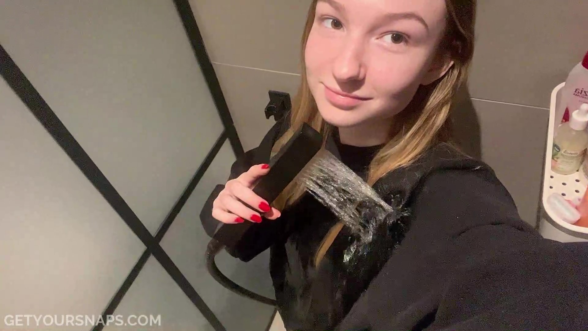 Zora takes a selfie video in the shower - frame at 1m36s
