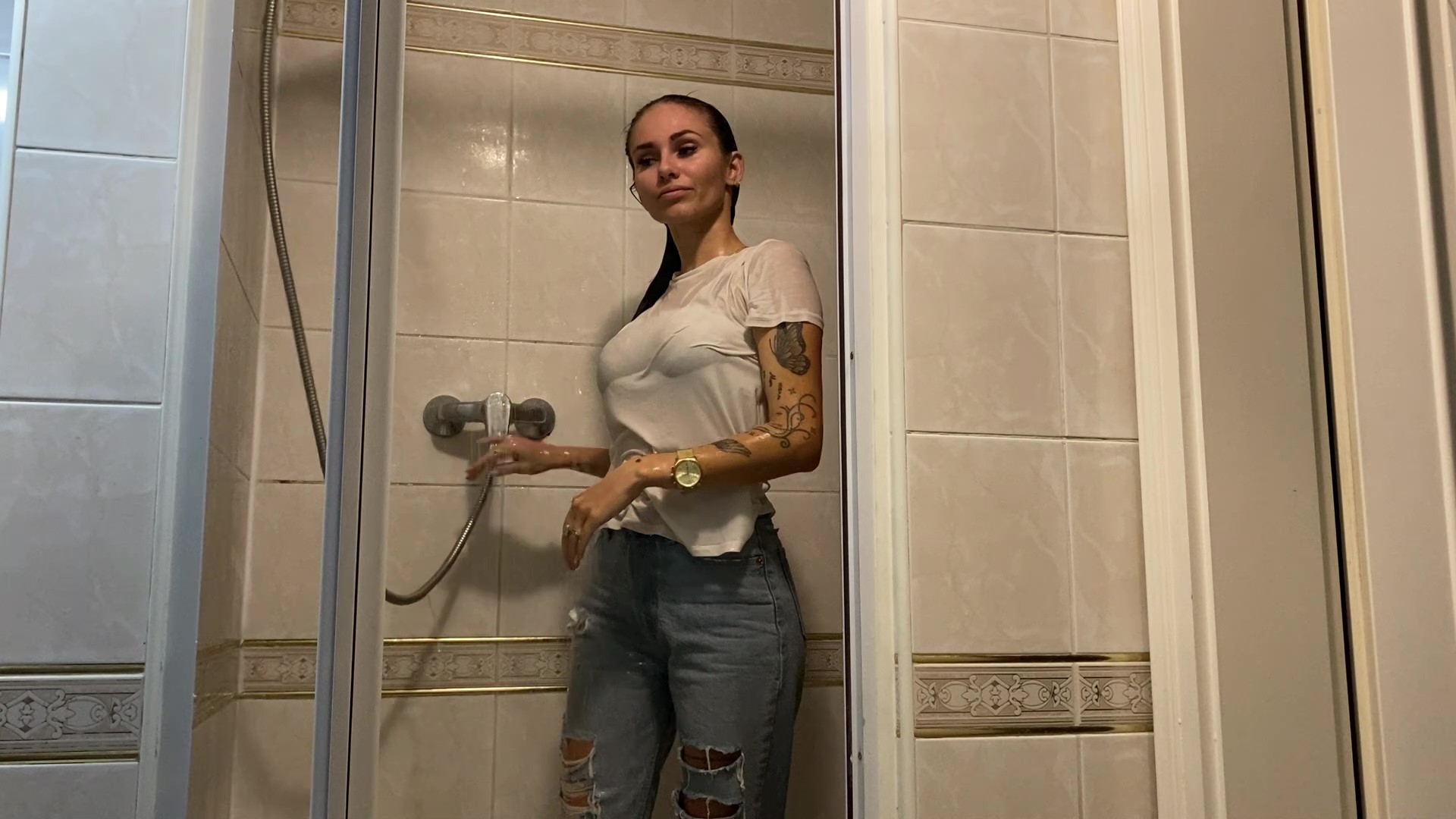 Olga takes a shower in jeans and hoodie after a hard day-1 - frame at 17m34s