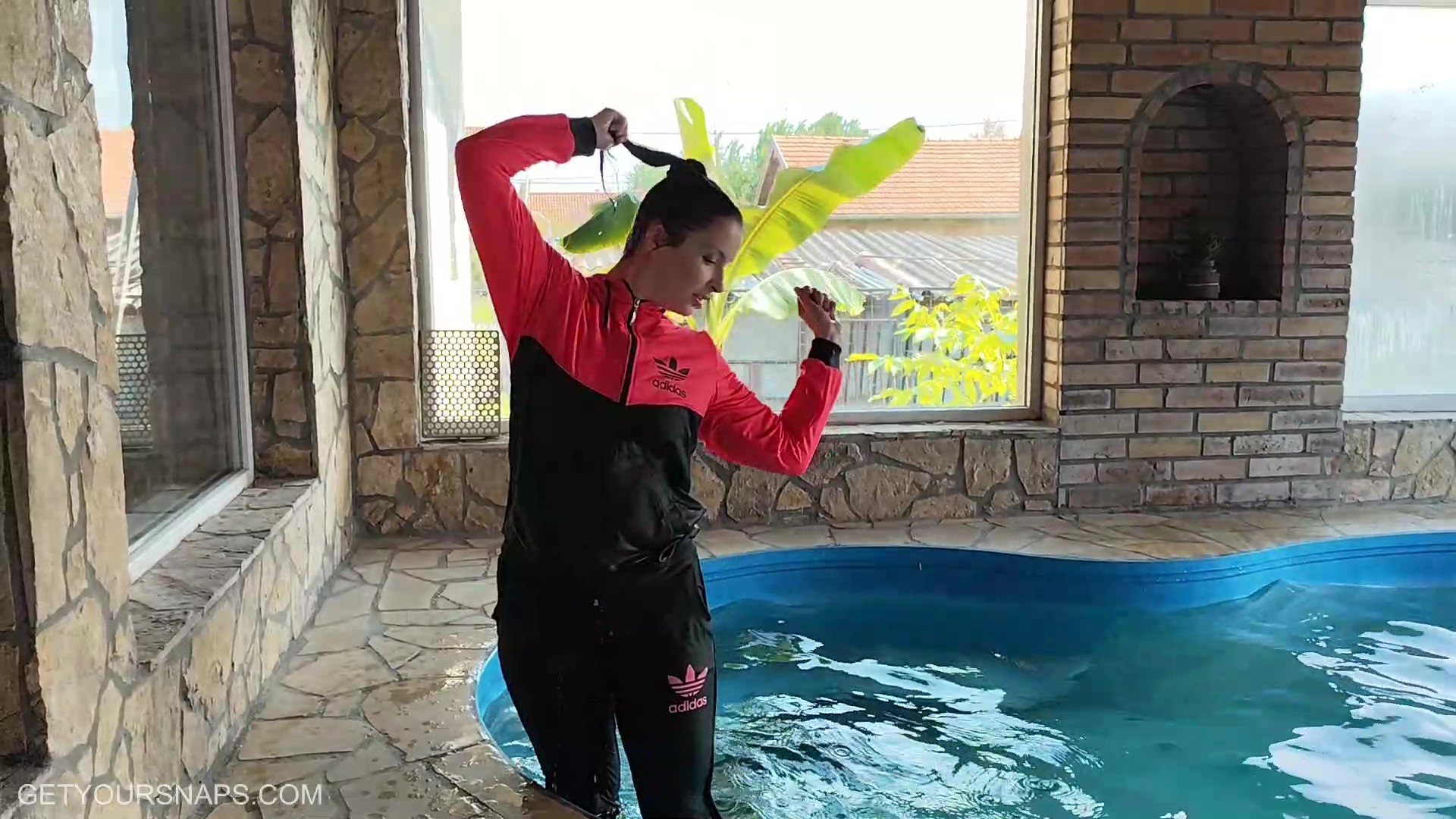 Vicky gets wet in her Adidas track suit - frame at 5m16s