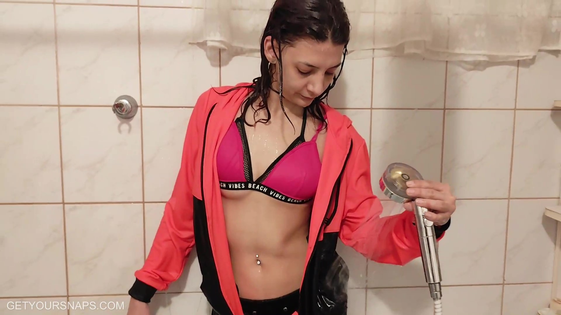 Mina gets wet in Adidas track suit - frame at 11m18s