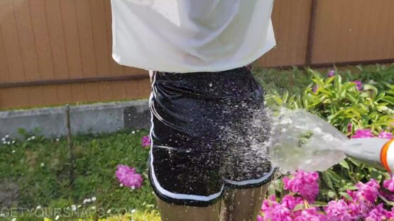 Vickey gets wet in the garden - Image 2