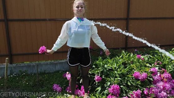 Vickey gets wet in the garden
