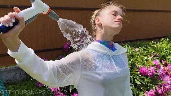 Vickey gets wet in the garden - Image 5