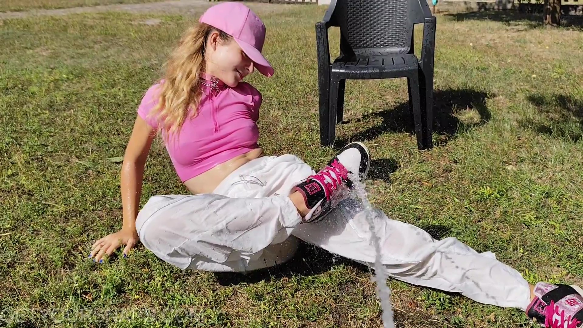 Violet gets wet in pink and white - frame at 2m21s