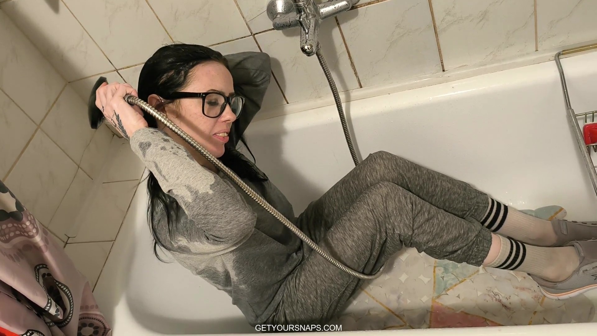 Carol take a shower in gray tracksuit