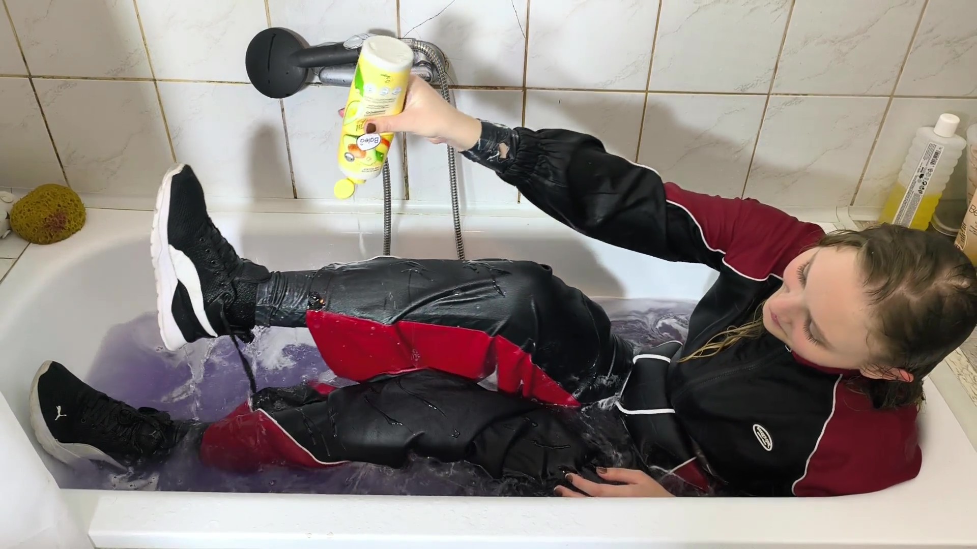 Luna takes a bath in two layers of clothing