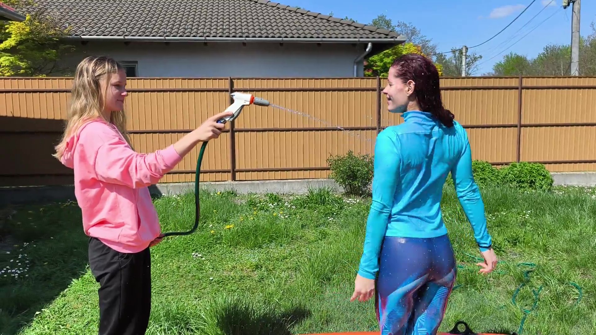 Lisa sprays Jazmin with the hose - Image 3