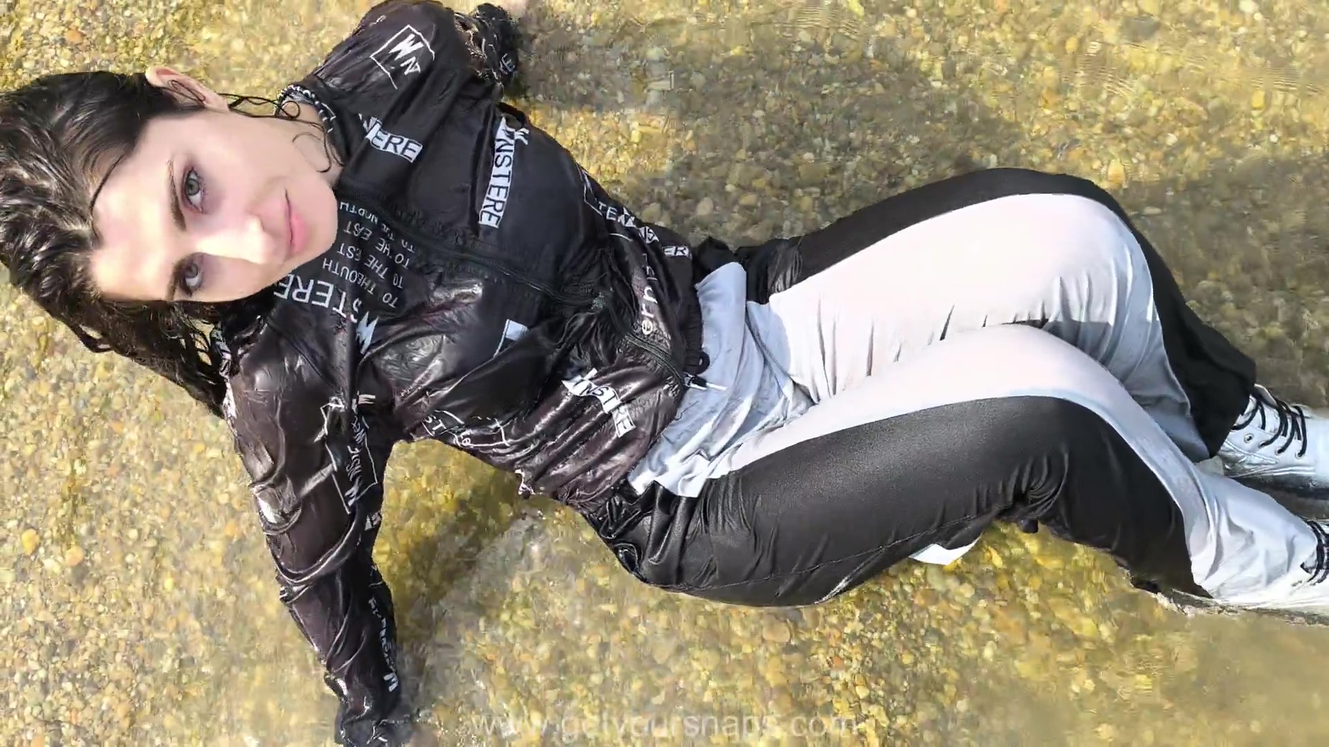 Brenda is bathing in the river fully clothed. - frame at 1m55s Brenda is bathing in the river fully clothed. - frame at 1m55s